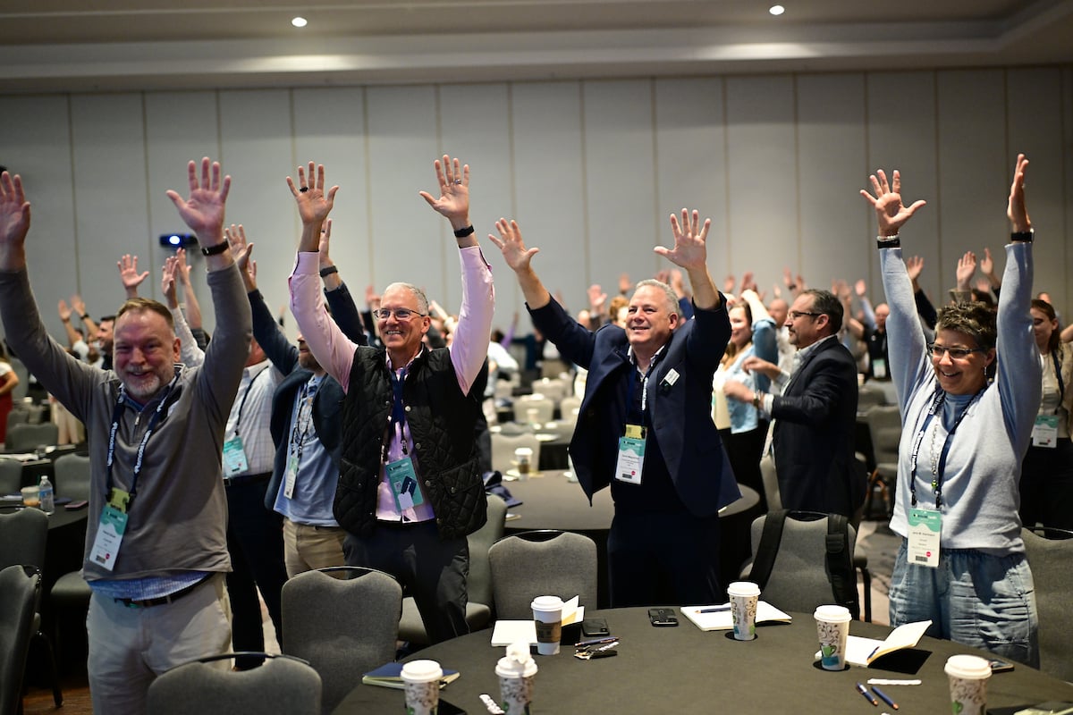 AIM 2026 - Hands raised during the final activity of the keynote address.